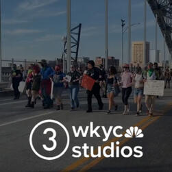 Protestors are now walking down from the bridge creating a human chain